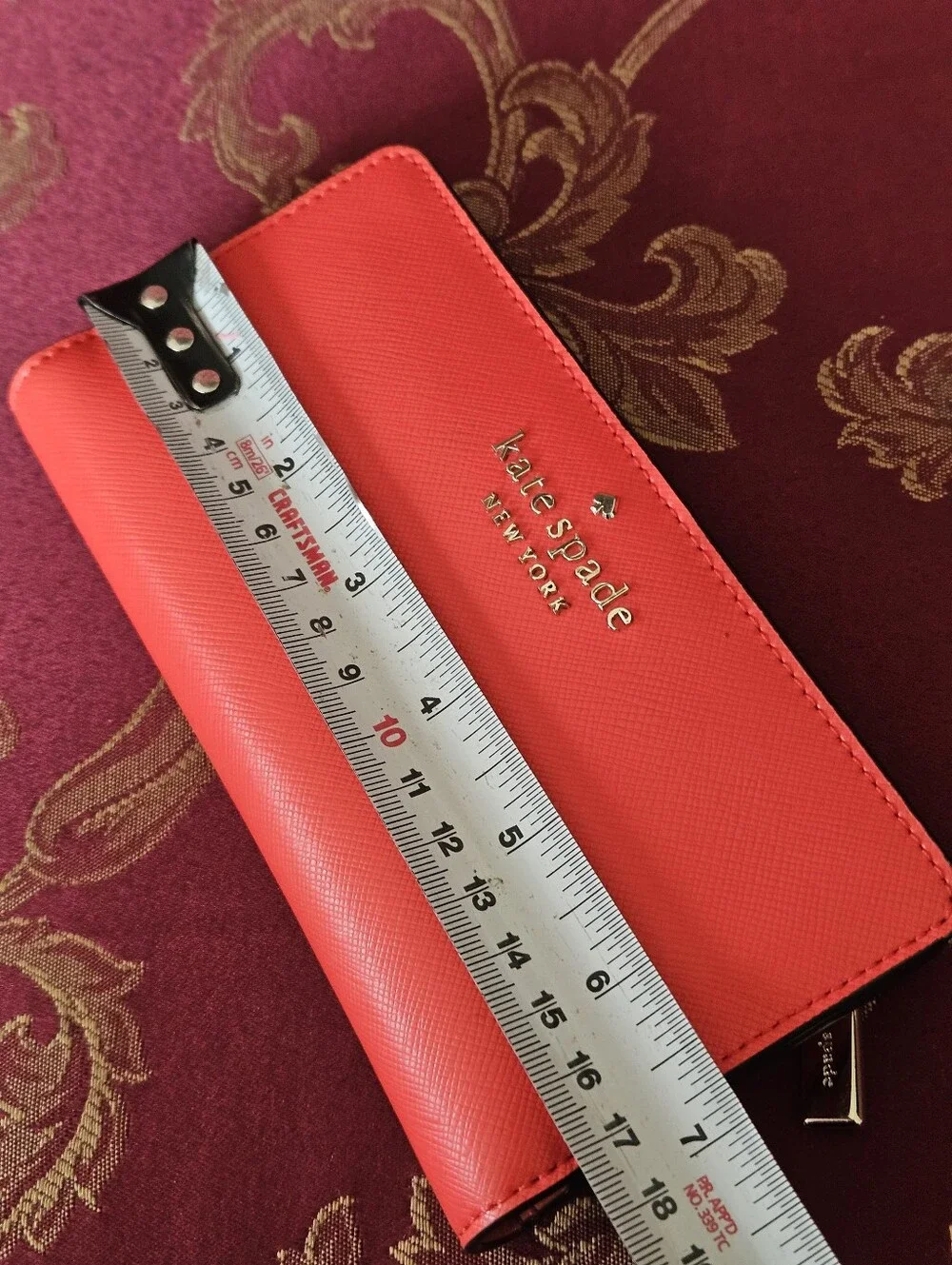 Kate Spade New York coral orange Saffiano leather continental wallet